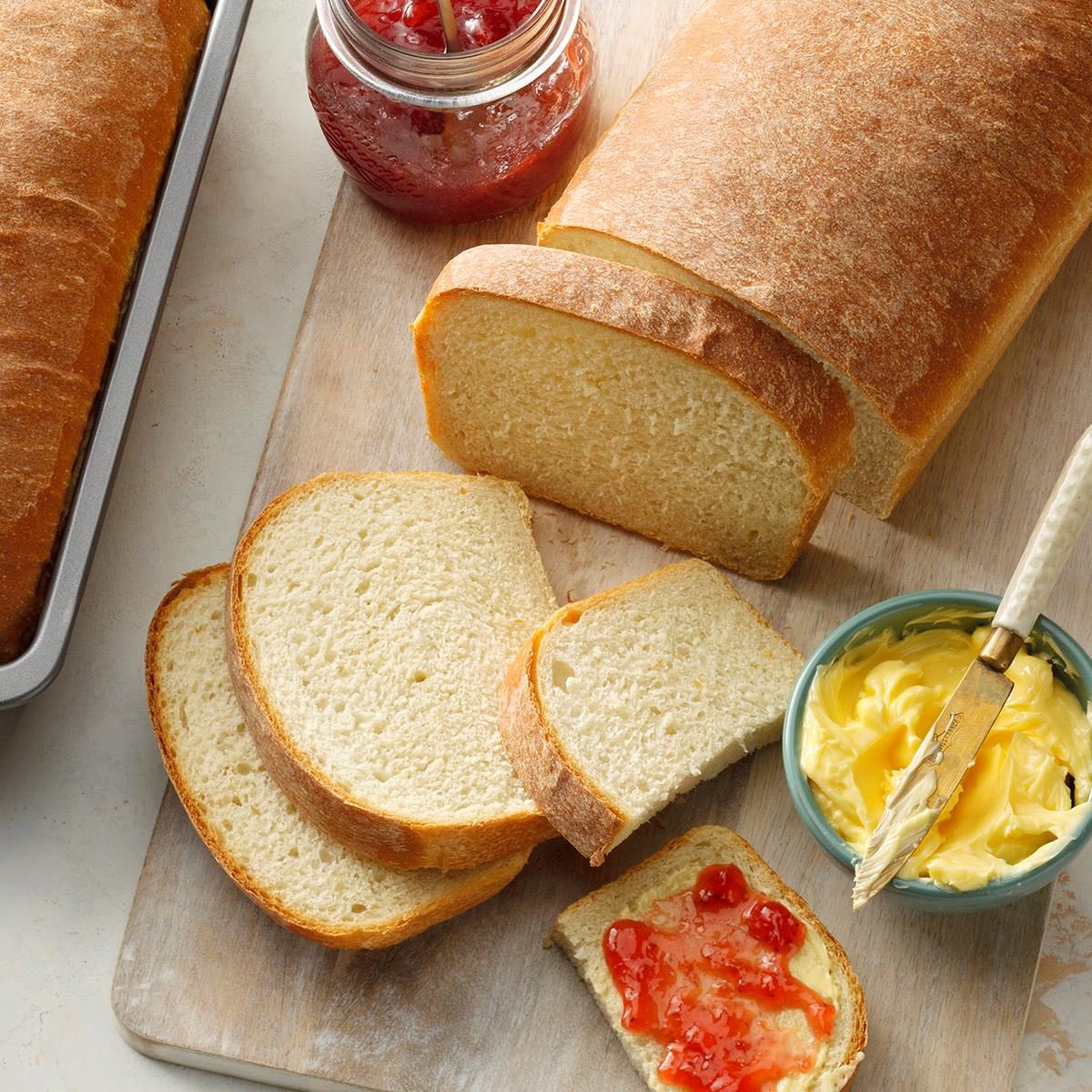 Fresh baked bread with jam and butter