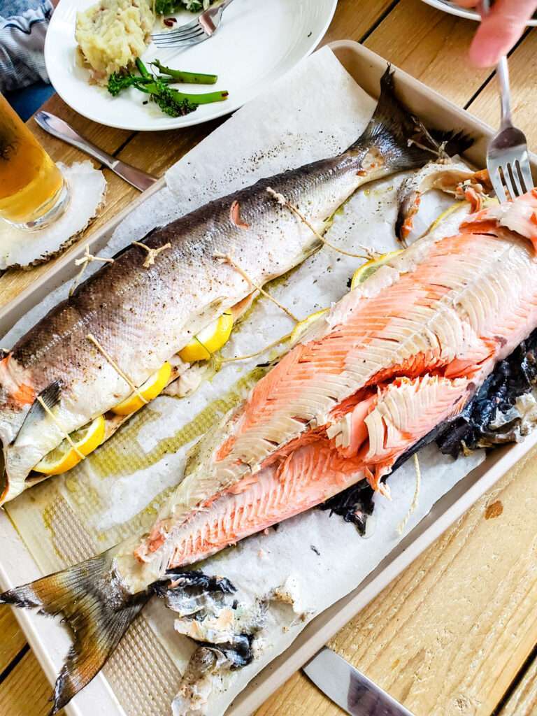 Whole baked salmon with lemon slices